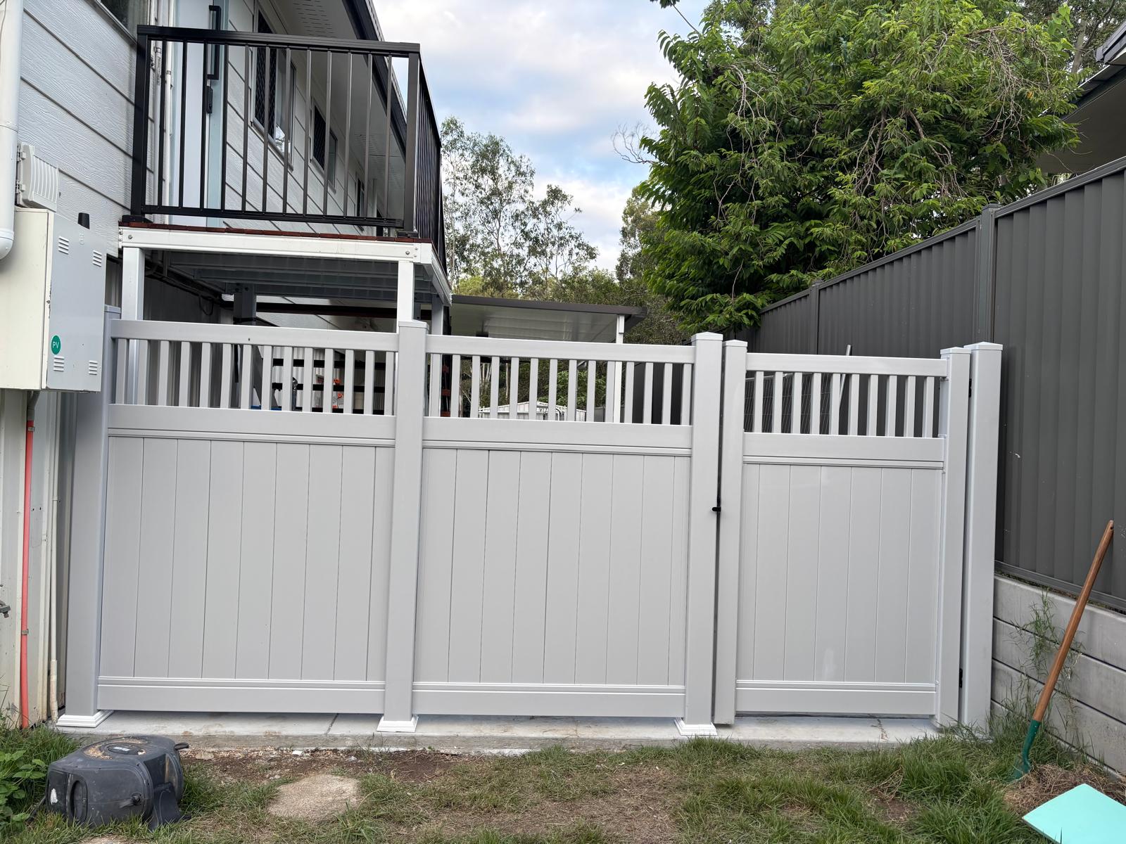 Light grey PVC fence and gate installation.